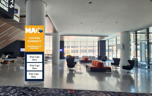 Modern office lobby with seating and large windows during daytime.